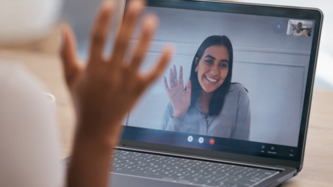 Coach waving at teacher through screen for a virtual call